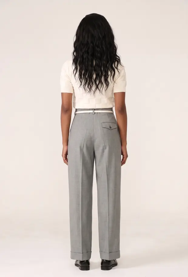 The same Garu try-on render from behind, showing how the trousers sit at the seat and hem